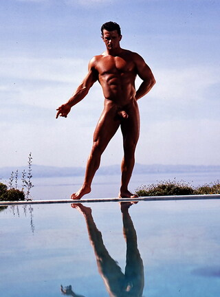 Muscle brunette man posing naked